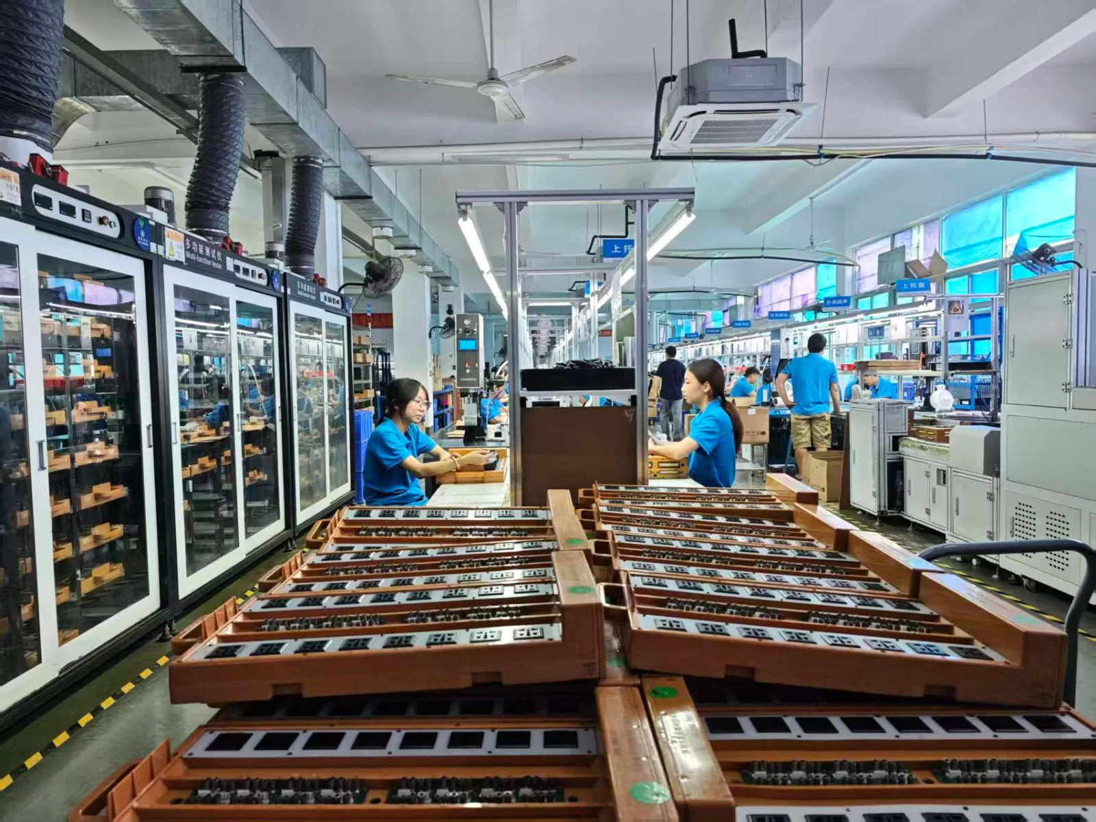 QIKUN Charger production workshop with assembly and aging test equipment