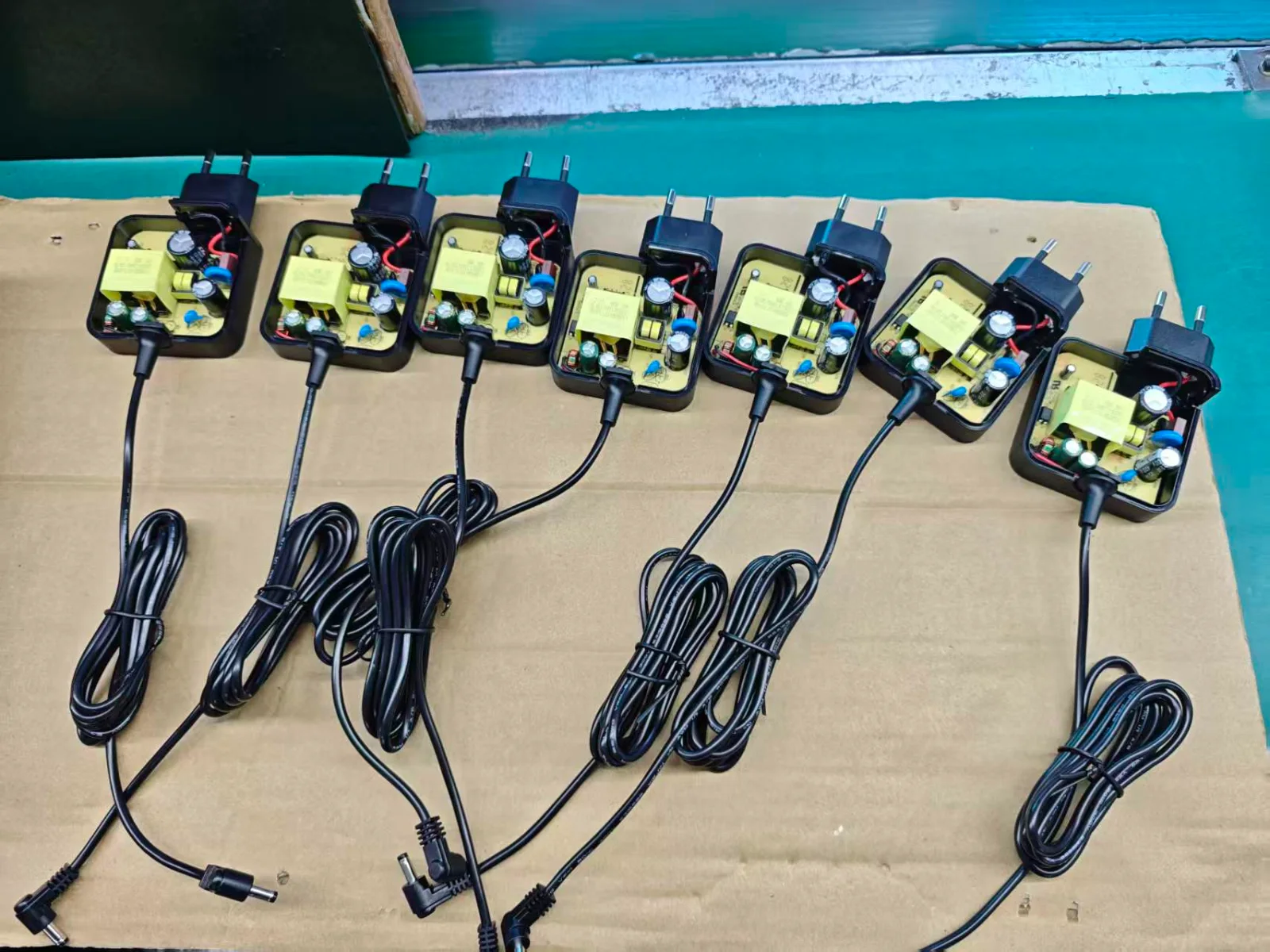 Travel charger internal assembly line before final housing and testing