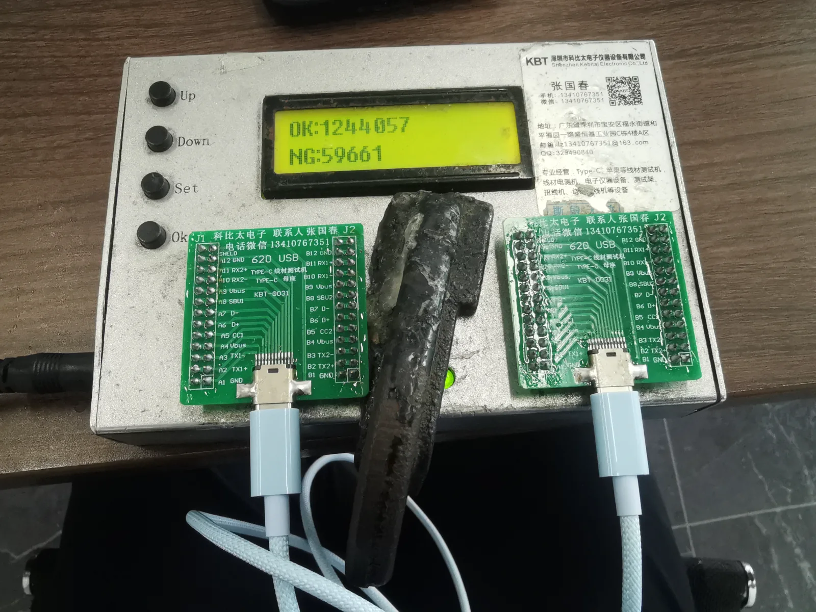 USB-C charging cable test fixture during quality inspection